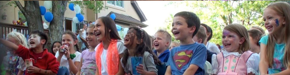rotating banner kids having fun watching the magic show